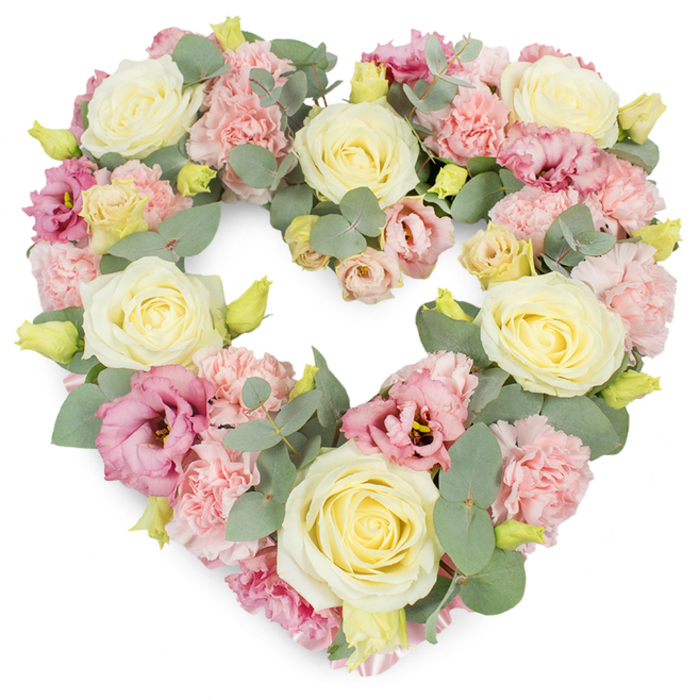 This image presents a generously filled, heart-shaped funeral wreath, carefully composed to convey tenderness and respect, set against a bright white background that allows every gentle hue to be clearly seen. The heart is meticulously formed from a dense blend of cream, pale yellow, and soft pink blooms, arranged so that each flower touches the next, creating a seamless, cushion-like surface. At intervals around the heart, creamy roses with tightly layered, velvety petals stand out as focal points, their classic shape and subtle fragrance suggesting purity, devotion, and a life well cherished. Between these roses, clusters of pastel pink carnations provide a soft contrast, their frilled petals overlapping like tiny silk ruffles and adding a sense of warmth and comfort. Threaded through the softer shades, richer magenta and mauve-pink lisianthus blossoms lend a slightly deeper, more contemplative tone, their open, cup-shaped flowers gently lifting the arrangement from purely pastel into something more complex and soulful. Silver-green eucalyptus leaves, with their rounded and oval shapes, weave through the flowers, following the curve of the heart and adding gentle movement and cool, calming colour that might call to mind the mature greenery around Emerson Park's quiet residential streets. Small, yellow-green buds are dotted throughout, suggesting new beginnings even at a time of farewell. The wreath feels luxurious and thoughtfully made, like something lovingly prepared by Emerson Park Florist for a local funeral service or memorial at a nearby chapel. It carries a soft but steady emotional weight, ideal for expressing sympathy, remembrance, and enduring love for someone greatly missed.